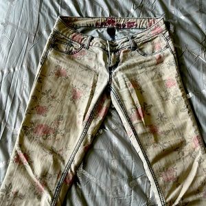 Low rise white skinny jeans with roses